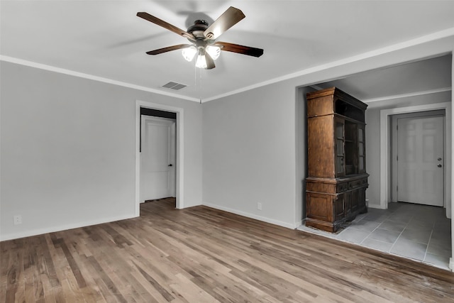 1316 Elm St, Bonham, TX 75418 - unfurnished living room with ceiling fan, light wood-style floors, and baseboards