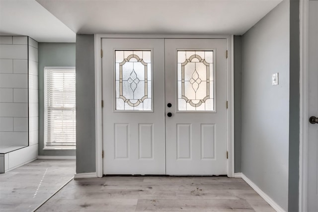 4205 Longstraw Dr, Fort Worth, TX 76137 - foyer with healthy amount of natural light, french doors, and light wood-style flooring