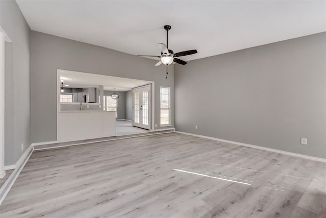 4205 Longstraw Dr, Fort Worth, TX 76137 - unfurnished living room with ceiling fan and light wood-type flooring