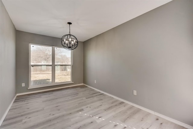 4205 Longstraw Dr, Fort Worth, TX 76137 - spare room with a chandelier and light wood-style flooring