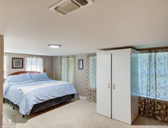 198 Main St, Doyline, LA 71023 - carpeted bedroom with a textured ceiling and a closet