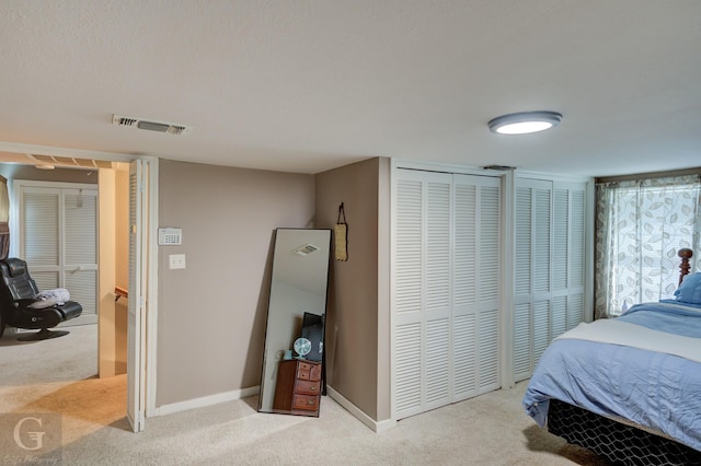 198 Main St, Doyline, LA 71023 - carpeted bedroom with two closets and baseboards