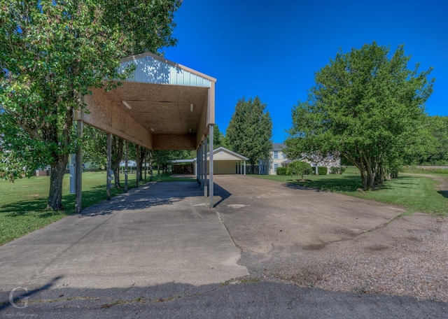 198 Main St, Doyline, LA 71023 - view of vehicle parking with a carport and concrete driveway