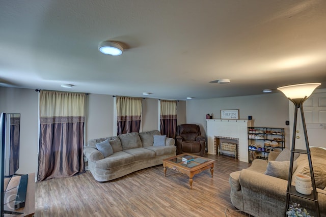 198 Main St, Doyline, LA 71023 - living room with wood finished floors and a brick fireplace