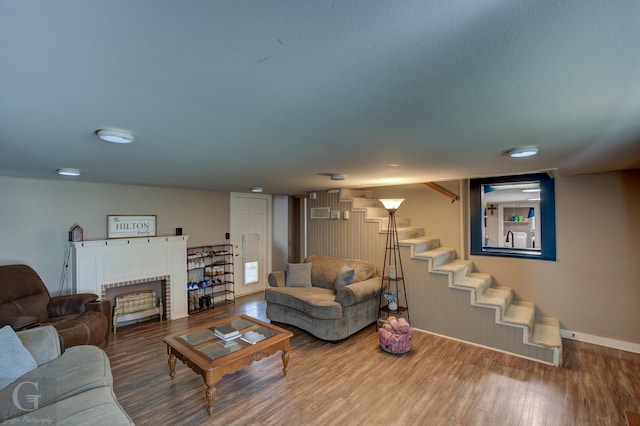 198 Main St, Doyline, LA 71023 - living room with wood finished floors, stairway, a fireplace, and baseboards
