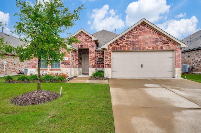 611 Gallop Dr, Princeton, TX 75407 - view of front of property with brick siding, driveway, an attached garage, a front yard, and roof with shingles