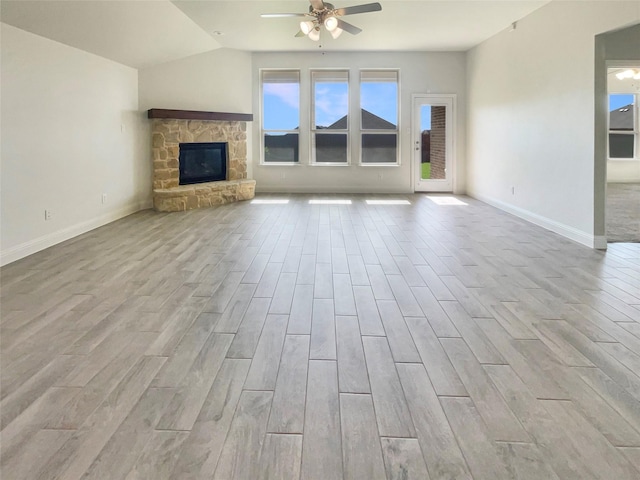 629 Brody Trl, Aledo, TX 76008 - unfurnished living room featuring a ceiling fan, wood finished floors, baseboards, a fireplace, and lofted ceiling