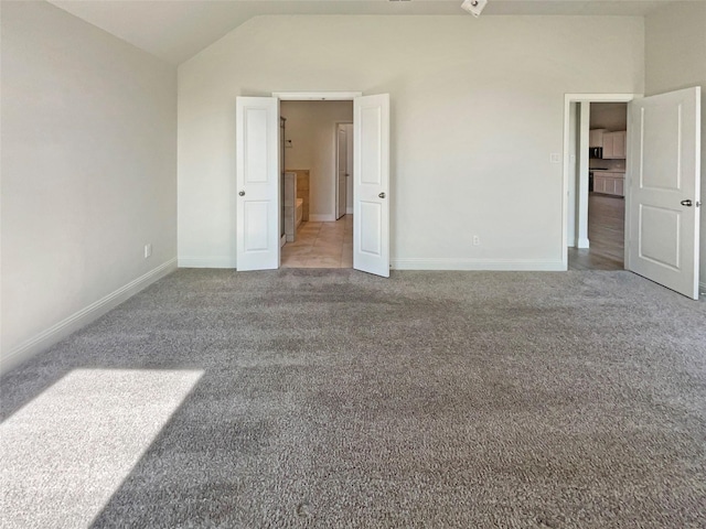 629 Brody Trl, Aledo, TX 76008 - unfurnished bedroom featuring lofted ceiling, carpet, and baseboards