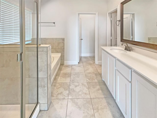 629 Brody Trl, Aledo, TX 76008 - full bathroom featuring vanity, a garden tub, a shower stall, tile patterned floors, and baseboards
