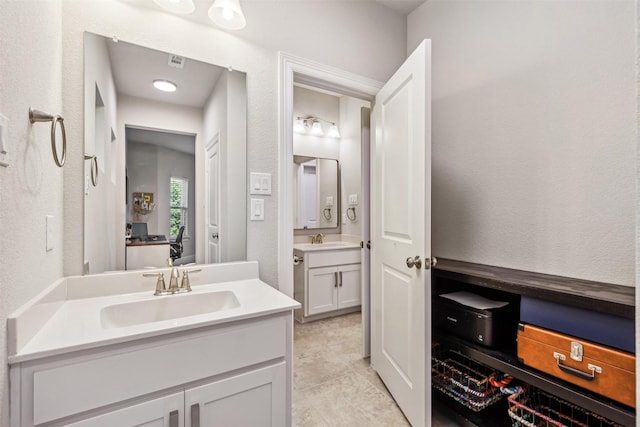 3317 Rough Creek Dr, Garland, TX 75040 - bathroom with two vanities and tile patterned floors