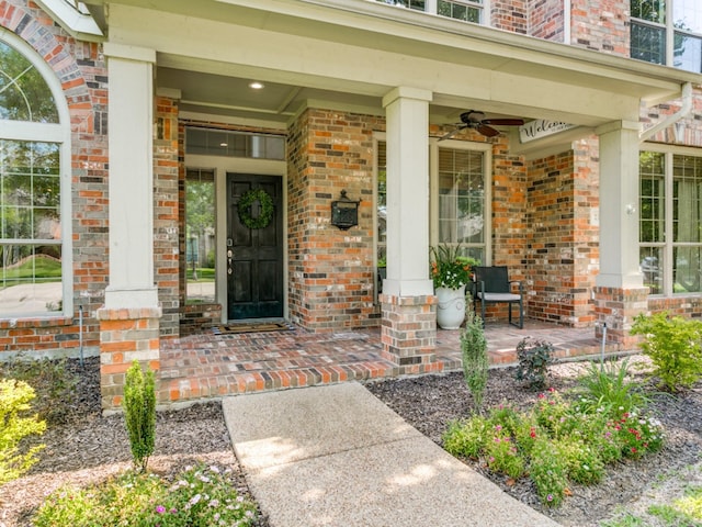 2270 Magic Mantle Dr, Lewisville, TX 75056 - doorway to property with covered porch, brick siding, and a ceiling fan
