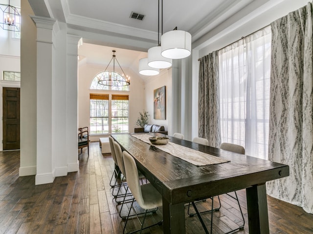 2270 Magic Mantle Dr, Lewisville, TX 75056 - dining room featuring dark wood-style floors, a chandelier, ornamental molding, baseboards, and decorative columns
