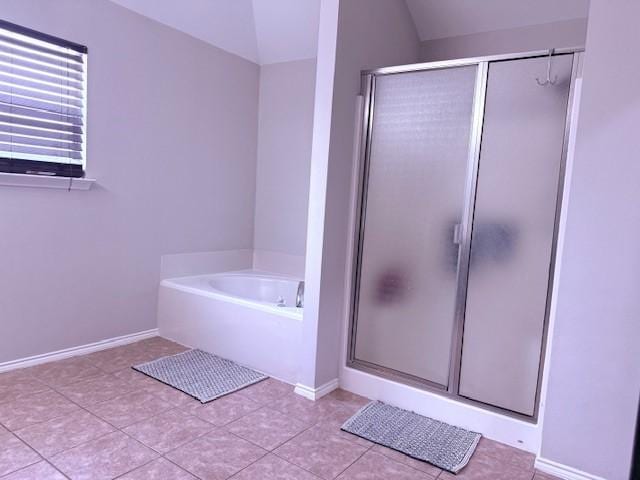 12616 Viewpoint Ln, Fort Worth, TX 76028 - bathroom featuring a stall shower, a garden tub, lofted ceiling, tile patterned floors, and baseboards