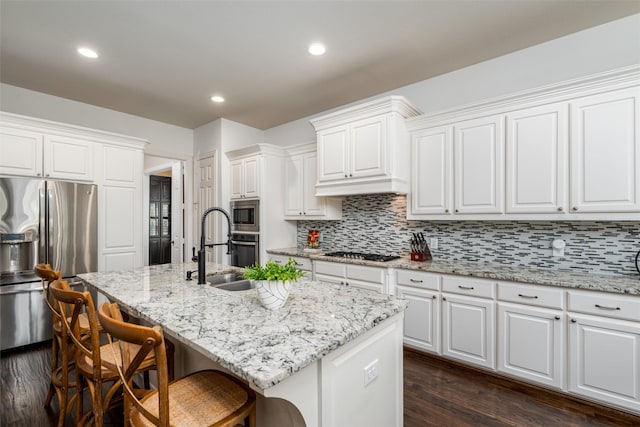 321 Hitch Wagon Dr, Mckinney, TX 75071 - kitchen with stainless steel appliances, a sink, backsplash, dark wood-type flooring, and recessed lighting