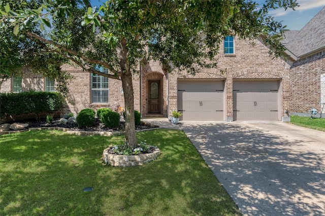 321 Hitch Wagon Dr, Mckinney, TX 75071 - view of front of home featuring brick siding, concrete driveway, and a front lawn