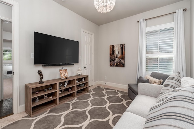 321 Hitch Wagon Dr, Mckinney, TX 75071 - living room with baseboards and a chandelier