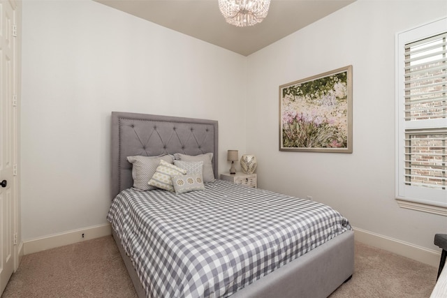 321 Hitch Wagon Dr, Mckinney, TX 75071 - carpeted bedroom with baseboards, multiple windows, and a chandelier