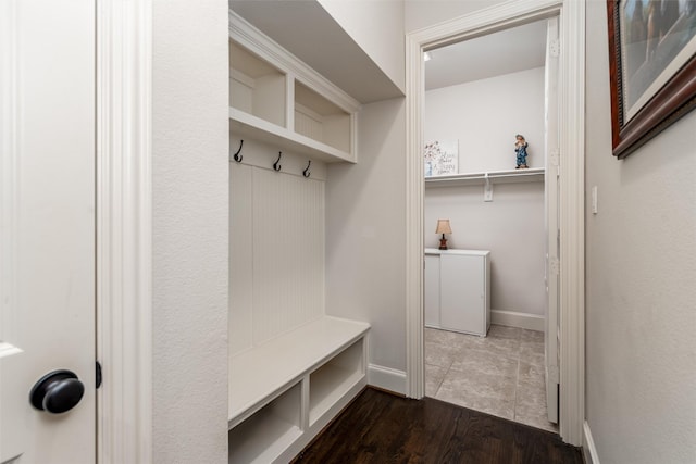 321 Hitch Wagon Dr, Mckinney, TX 75071 - mudroom with baseboards and dark wood-type flooring