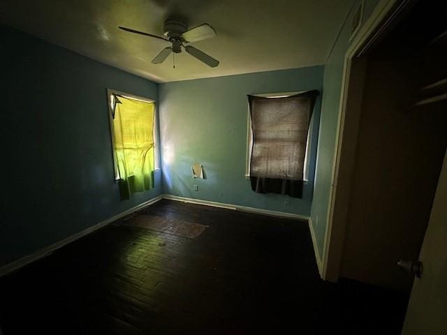 2915 56th St, Dallas, TX 75241 - empty room featuring baseboards, wood finished floors, a ceiling fan, and plenty of natural light