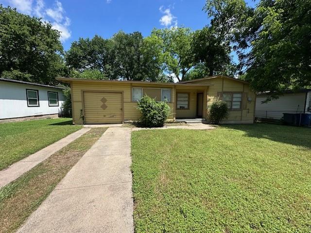 2915 56th St, Dallas, TX 75241 - ranch-style house with driveway, a front lawn, and an attached garage