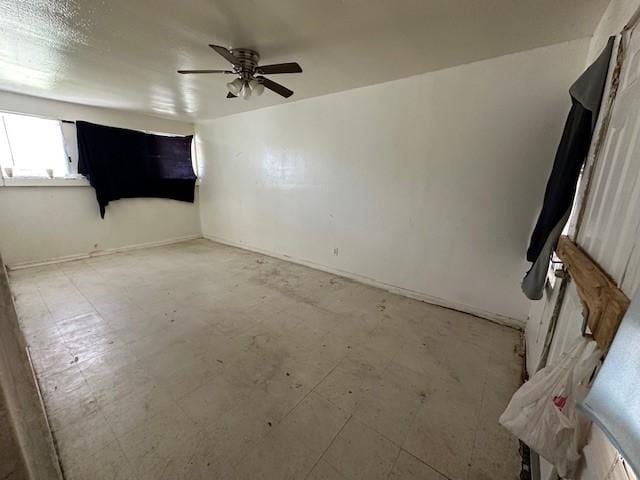 2915 56th St, Dallas, TX 75241 - spare room with a ceiling fan and baseboards