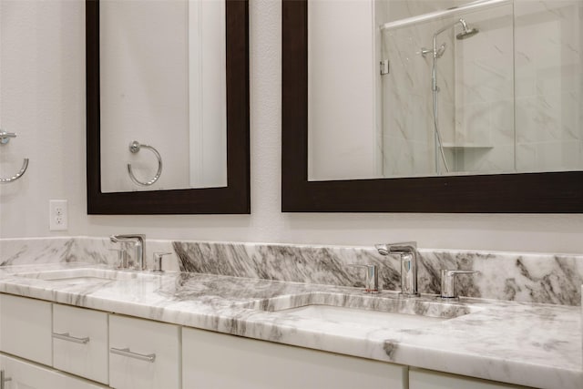 4651 New Water Ln, Dallas, TX 75219 - bathroom with double vanity and a marble finish shower