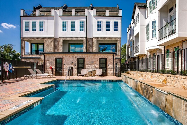 4651 New Water Ln, Dallas, TX 75219 - community pool featuring a patio area