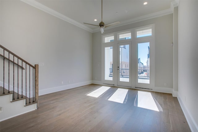 4651 New Water Ln, Dallas, TX 75219 - spare room with wood finished floors, ceiling fan, ornamental molding, baseboards, and stairs