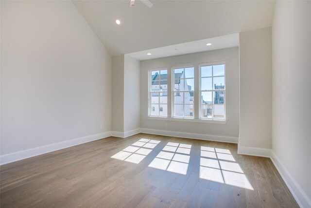 4651 New Water Ln, Dallas, TX 75219 - unfurnished room with wood finished floors, baseboards, recessed lighting, ceiling fan, and lofted ceiling