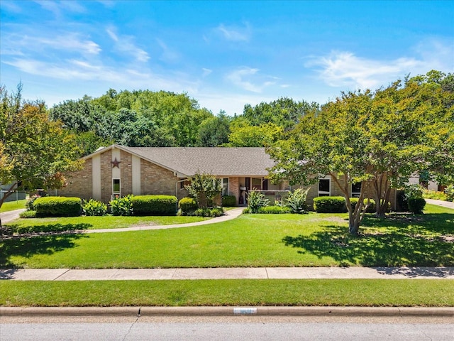 3601 University Dr, Garland, TX 75043 - view of front of house featuring a front yard and brick siding