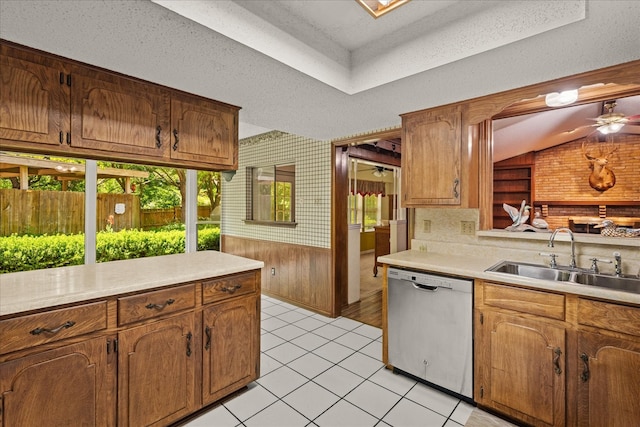 3601 University Dr, Garland, TX 75043 - kitchen featuring dishwasher, a sink, light countertops, a ceiling fan, and vaulted ceiling