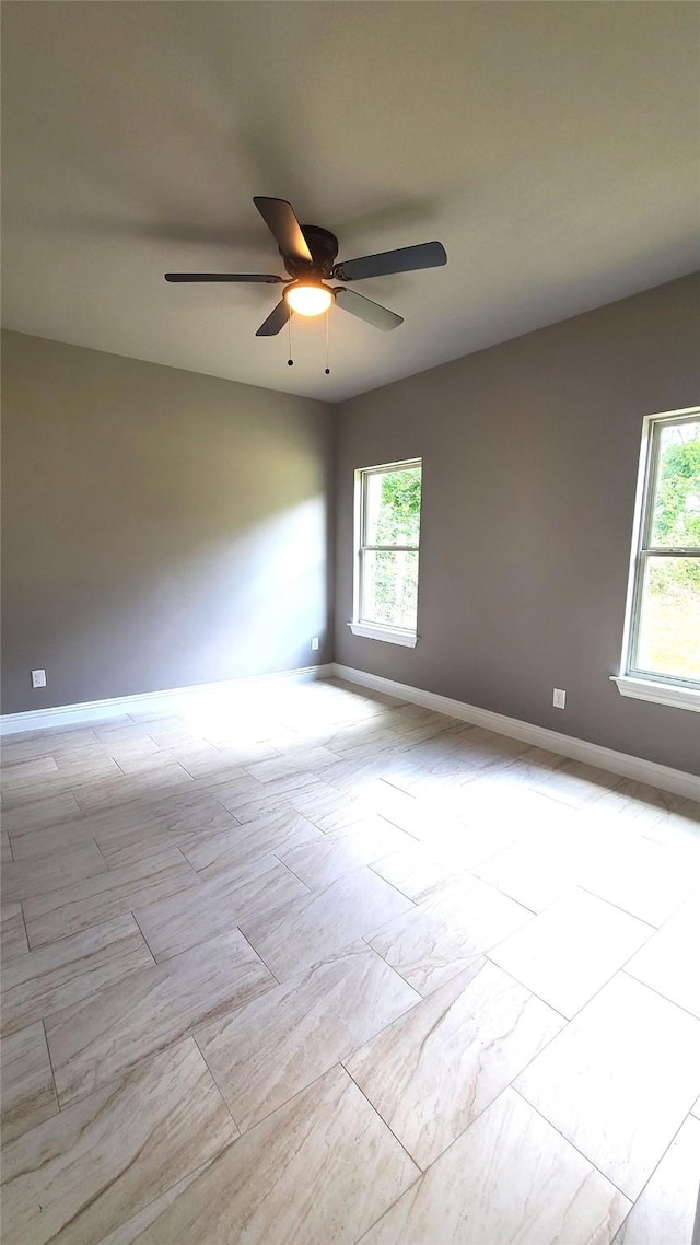 1820 Smoke Tree Ln, Dallas, TX 75253 - unfurnished room featuring a ceiling fan, healthy amount of natural light, and baseboards