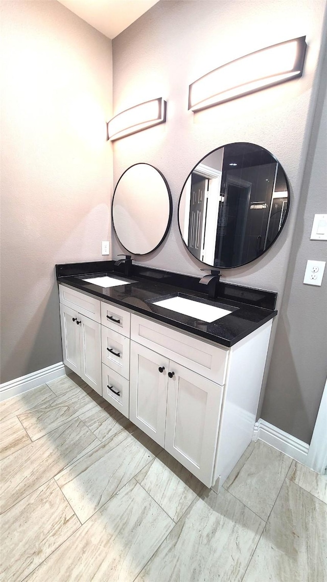 1820 Smoke Tree Ln, Dallas, TX 75253 - full bathroom featuring double vanity and baseboards