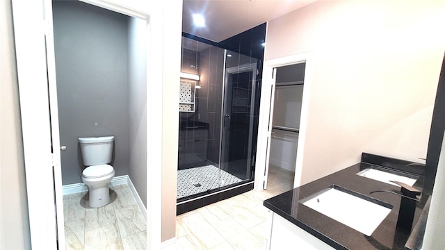 1820 Smoke Tree Ln, Dallas, TX 75253 - bathroom featuring vanity, a stall shower, marble look tile flooring, and toilet