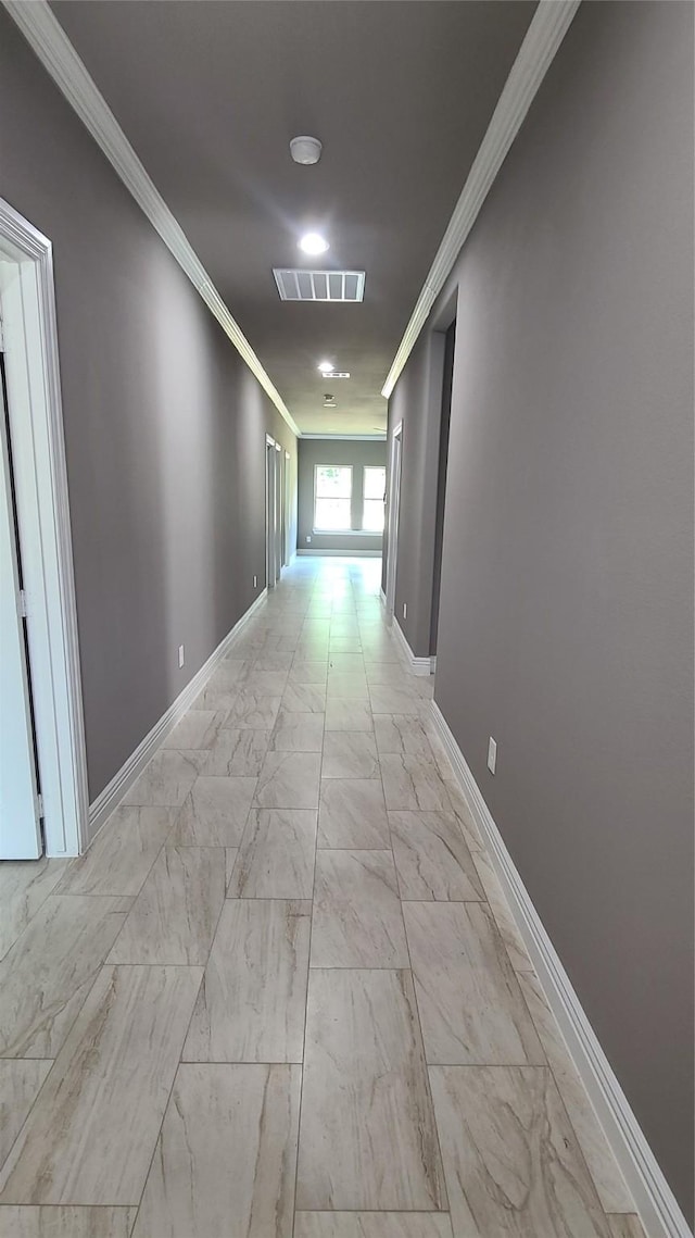 1820 Smoke Tree Ln, Dallas, TX 75253 - hall featuring crown molding, baseboards, and light marble finish floors