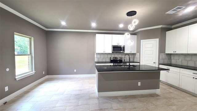 1820 Smoke Tree Ln, Dallas, TX 75253 - kitchen with appliances with stainless steel finishes, dark countertops, a sink, ornamental molding, and backsplash