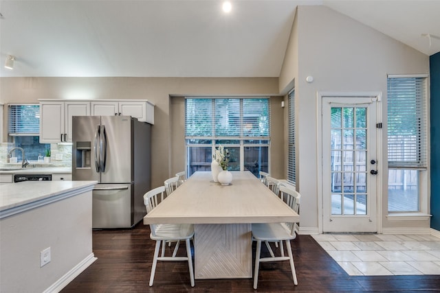 2300 Pagoda Oak Dr, Plano, TX 75074 - dining space with wood finished floors, vaulted ceiling, and baseboards