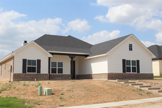 10117 Castleberry Ln, Waco, TX 76712 - view of front of property featuring brick siding and roof with shingles