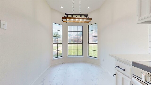 2605 Strother Dr, Garland, TX 75044 - unfurnished dining area with light marble finish floors, baseboards, and recessed lighting