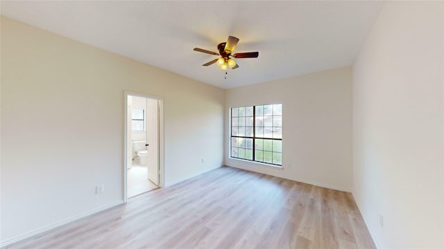 2605 Strother Dr, Garland, TX 75044 - unfurnished room featuring a ceiling fan, light wood-type flooring, and baseboards