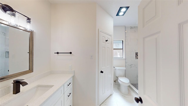 2605 Strother Dr, Garland, TX 75044 - bathroom with toilet, vanity, a marble finish shower, and marble finish flooring