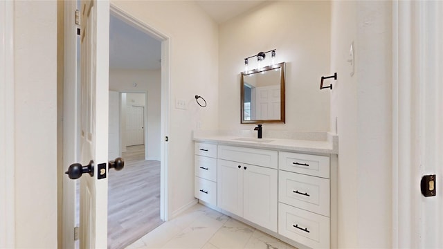 2605 Strother Dr, Garland, TX 75044 - bathroom with vanity, marble finish floors, and baseboards