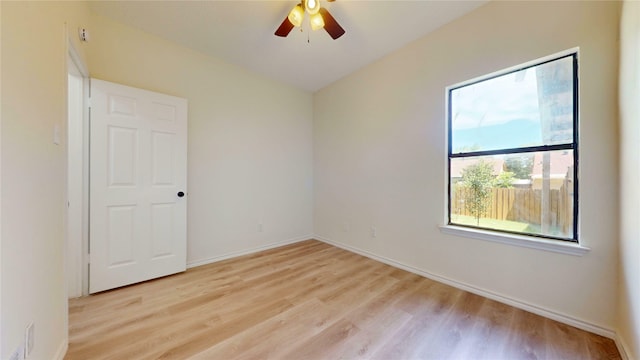 2605 Strother Dr, Garland, TX 75044 - spare room with light wood-type flooring, ceiling fan, and baseboards