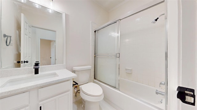 2605 Strother Dr, Garland, TX 75044 - full bathroom featuring toilet, vanity, and enclosed tub / shower combo