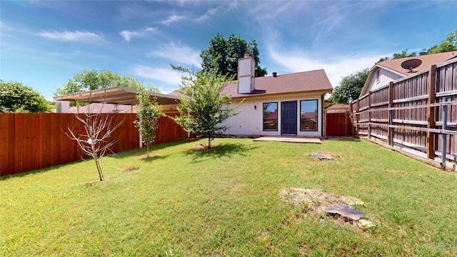 2605 Strother Dr, Garland, TX 75044 - back of house with a chimney