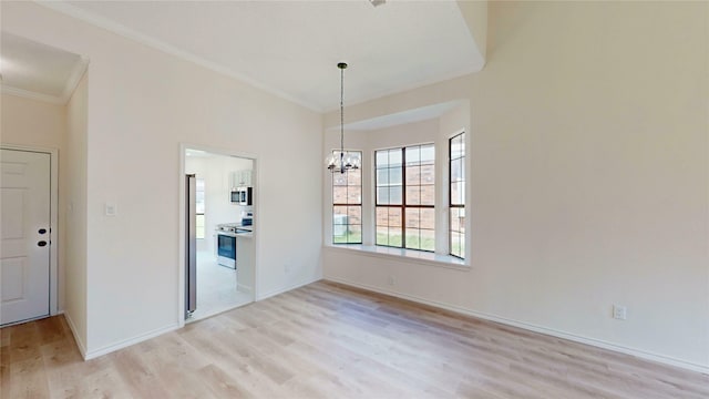 2605 Strother Dr, Garland, TX 75044 - unfurnished room featuring ornamental molding, light wood-style floors, a chandelier, and baseboards