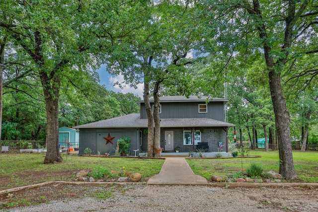 7300 W Line Rd, Collinsville, TX 76233 - view of front of house with brick siding and view of wooded area