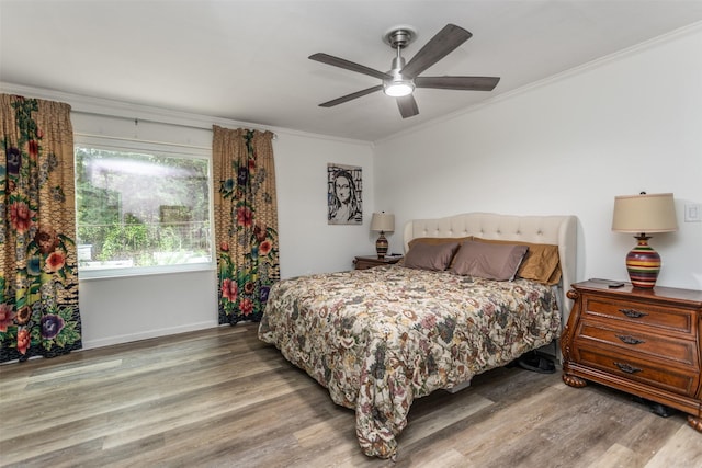 7300 W Line Rd, Collinsville, TX 76233 - bedroom with wood finished floors, ornamental molding, baseboards, and a ceiling fan