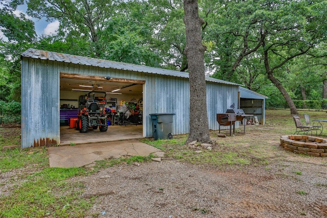 7300 W Line Rd, Collinsville, TX 76233 - view of pole building with an outdoor fire pit