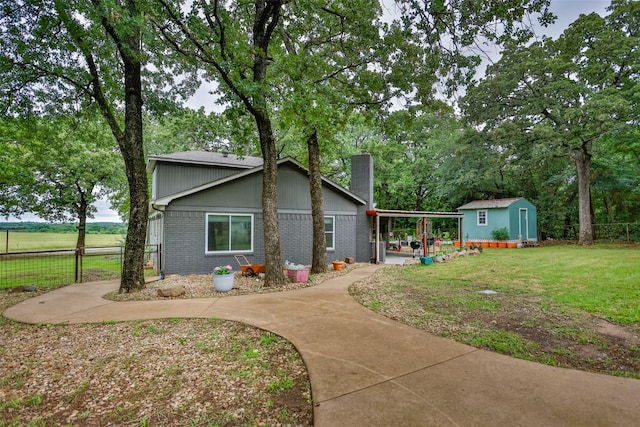 7300 W Line Rd, Collinsville, TX 76233 - view of front of property featuring a chimney, brick siding, and a carport